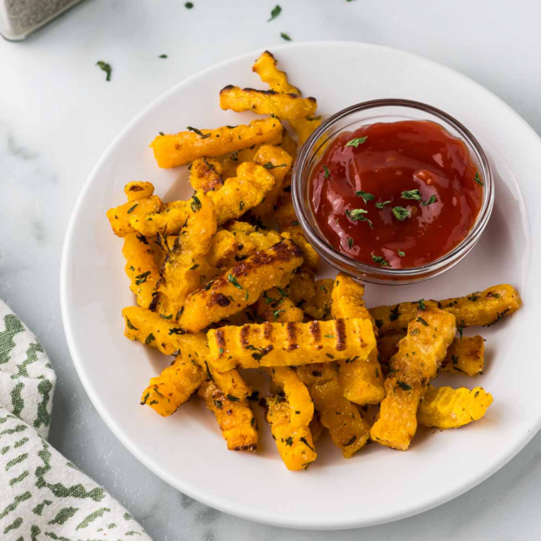 Golden brown air-fried butternut squash fries served with ranch dressing