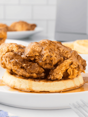 Air Fryer Chicken and Waffles-- There is nothing better for a quick dinner than this homemade Air Fyre chicken and waffles Recipe! Air Fried Buttermilk Fried Chicken is on top of a pile of fluffy waffles. What is better?
