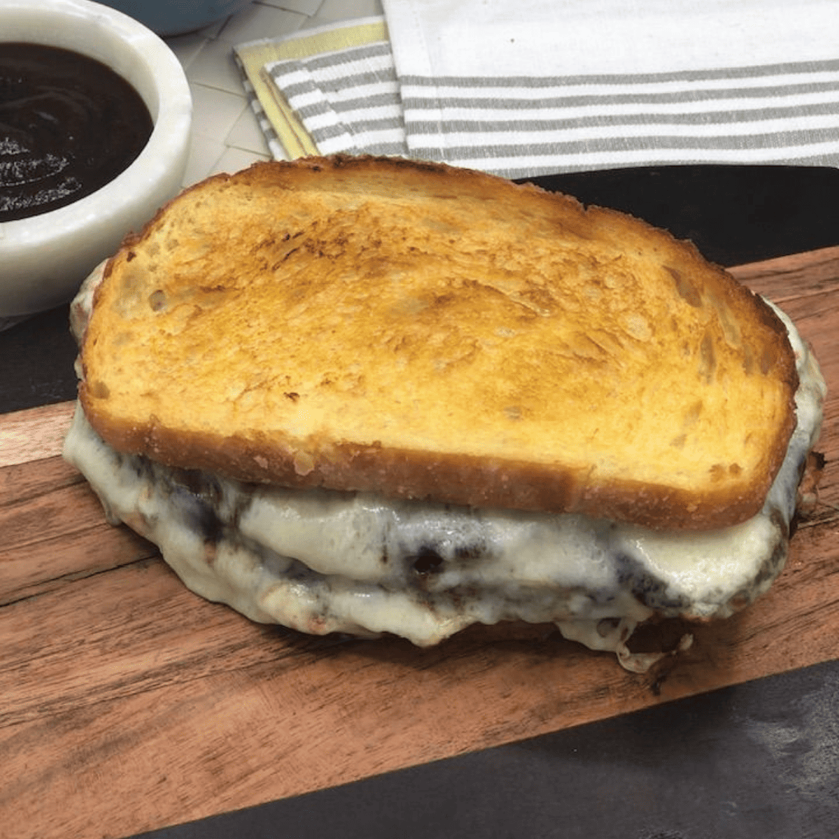 Air Fryer Meatloaf Sandwich with melted cheese and crispy edges on a soft bun.