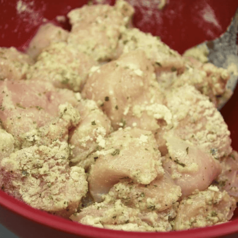 Marinated chicken pieces ready for the air fryer to create Ranch Chicken Bites.