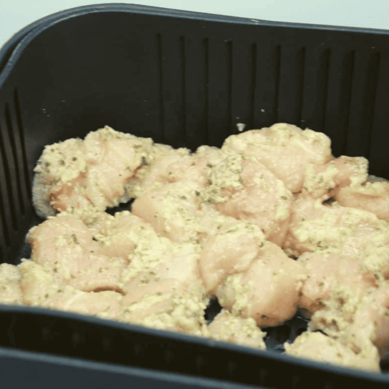 Marinated chicken pieces ready for the air fryer to create Ranch Chicken Bites.