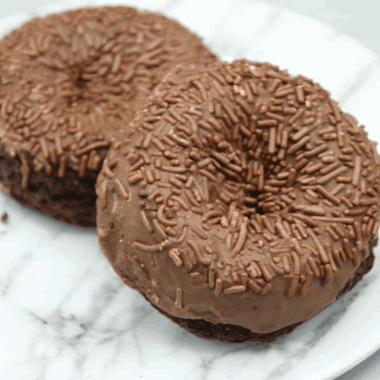 Homemade Tim Hortons chocolate glazed donut copycat recipe with fluffy fried dough and rich chocolate glaze.