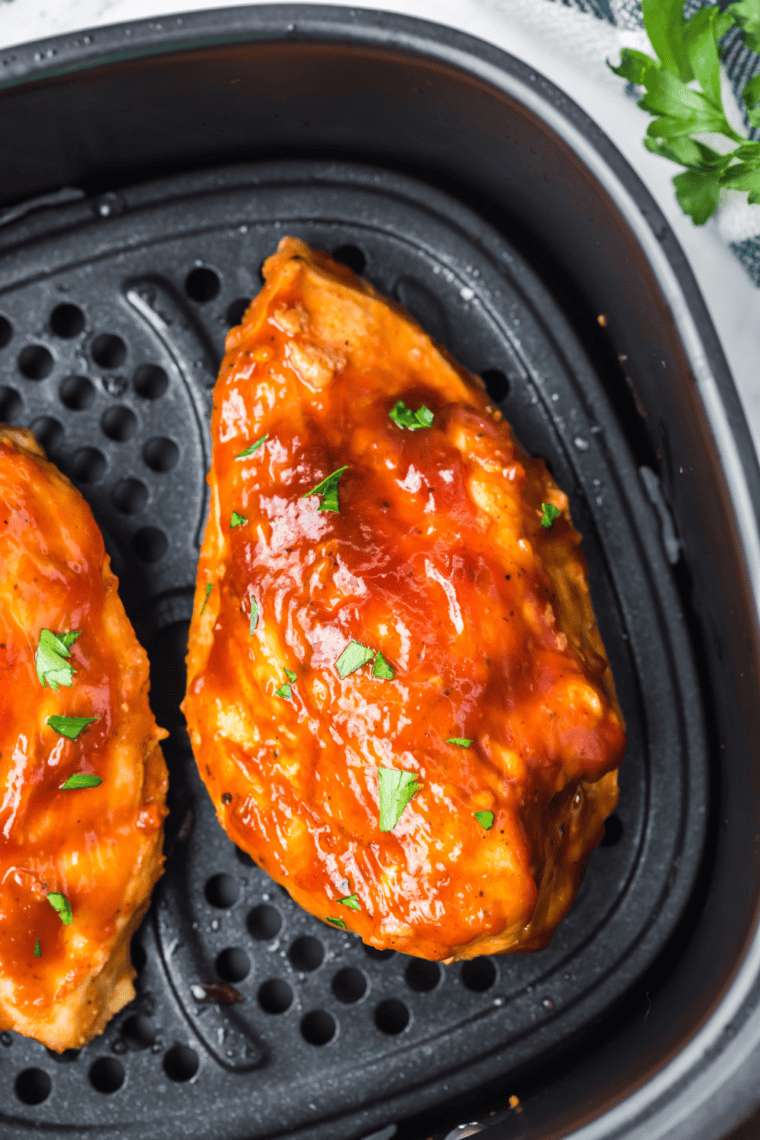 Crispy golden chicken wings in the air fryer after flipping halfway through