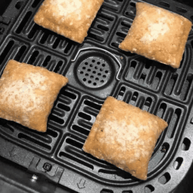 Correctly spaced food in an air fryer basket demonstrating how to use an air fryer