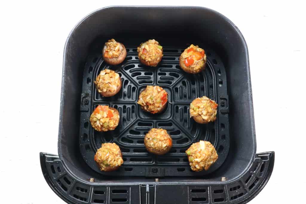 place red lobster mushrooms in the air fryer basket, raw mushrooms shown.