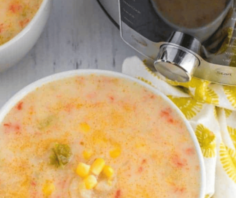 "Hearty serving of Instant Pot Copycat Panera Corn Chowder in a rustic bowl, ready to be enjoyed."