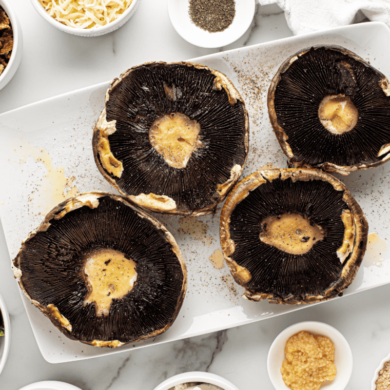 Clean the mushrooms, remove the stems, and pat them dry before setting them aside.