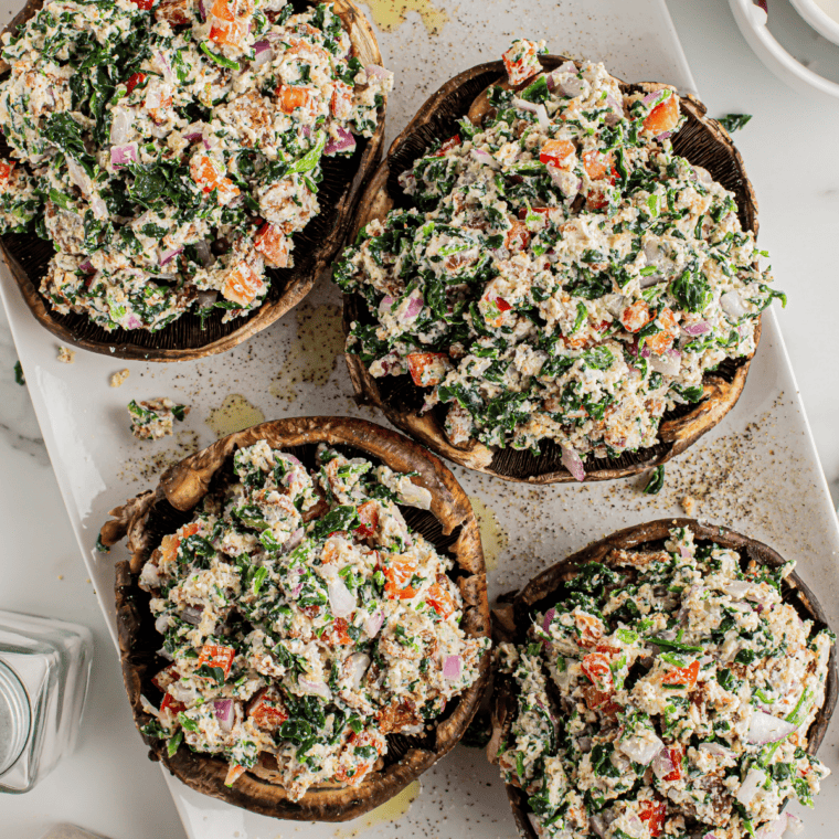 Spoon and pack the spinach mixture into mushroom caps.