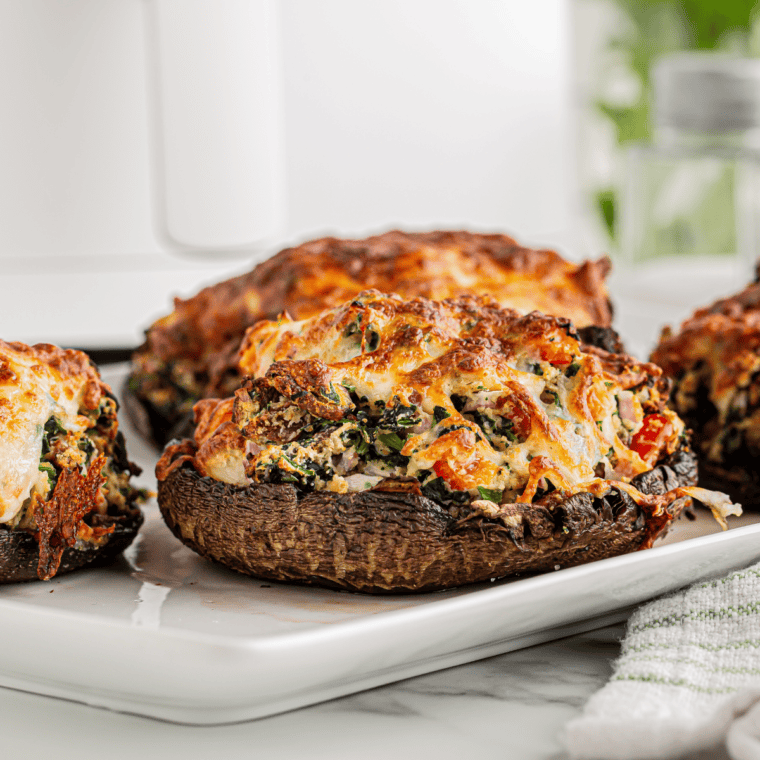 Plump mushroom caps filled with seasoned breadcrumbs, cheese, and aromatic herbs, just like Maggiano’s stuffed mushrooms.