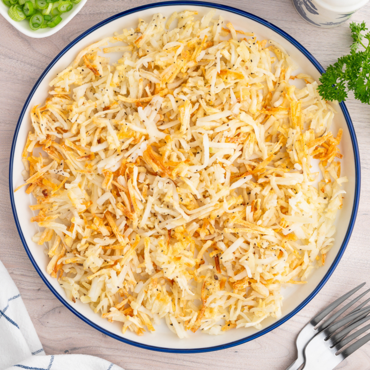 Shredded hash browns air fried until crunchy and golden with soft fluffy centers for classic diner-style breakfast potatoes