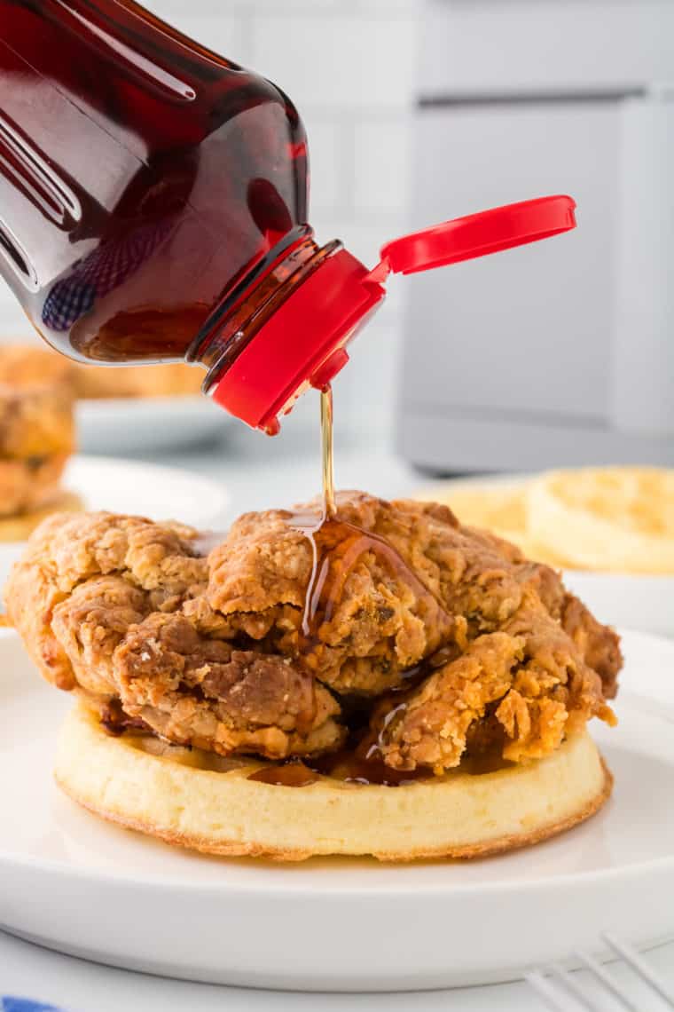 Air Fryer Chicken and Waffles Served with Fresh Fruit - A colorful plate of air fryer chicken and waffles accompanied by fresh fruit, such as strawberries and blueberries
