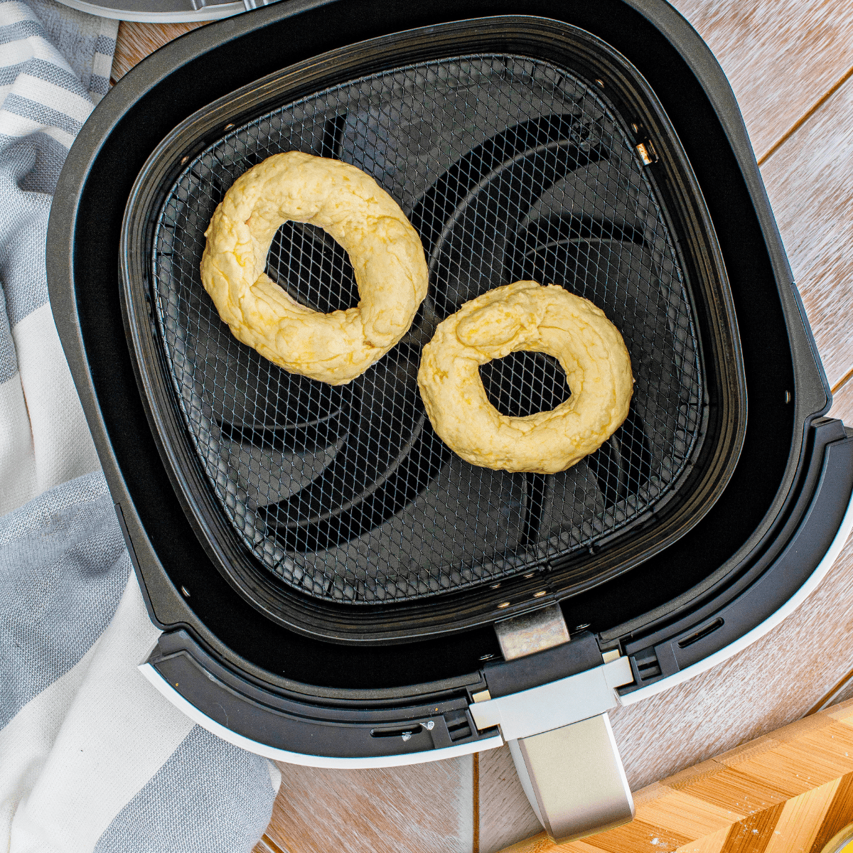 "Air Fryer Bagels cooking in the air fryer basket"