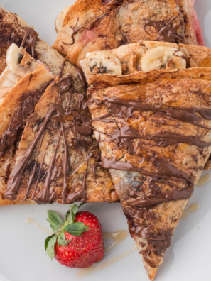 Air fryer banana Nutella quesadilla cut into wedges, melted Nutella and caramelized banana visible at the cut edge