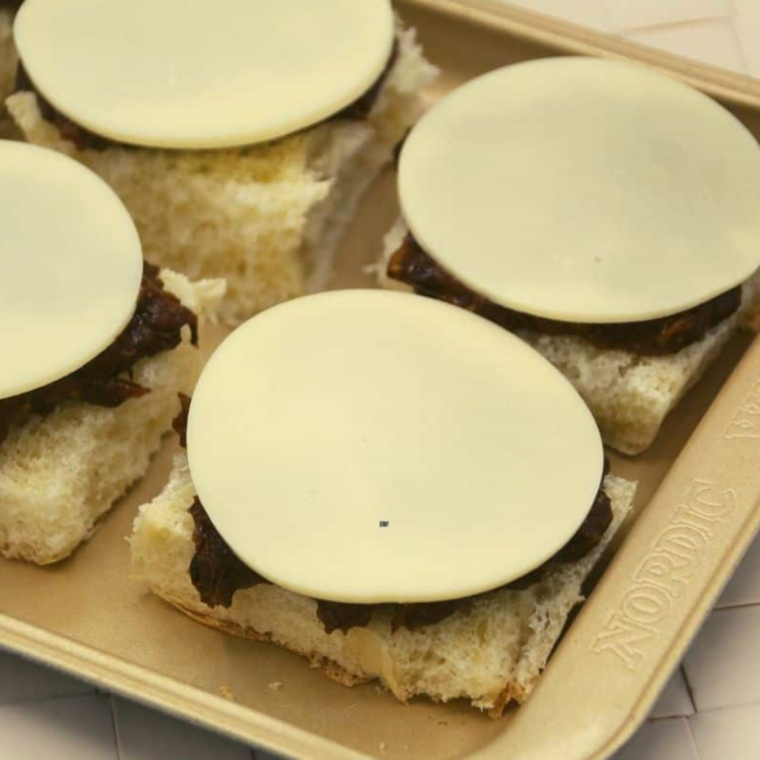 Making Air Fryer Cheesy BBQ Pork Sliders is a straightforward process that delivers delicious, party-worthy treats in no time. Here's how to whip up these savory, cheesy sliders: