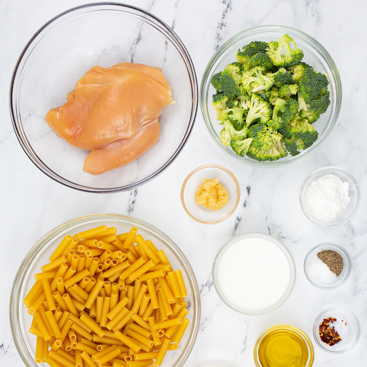 Ingredients needed for chicken and broccoli cooked in the air fryer on a kitchen table.