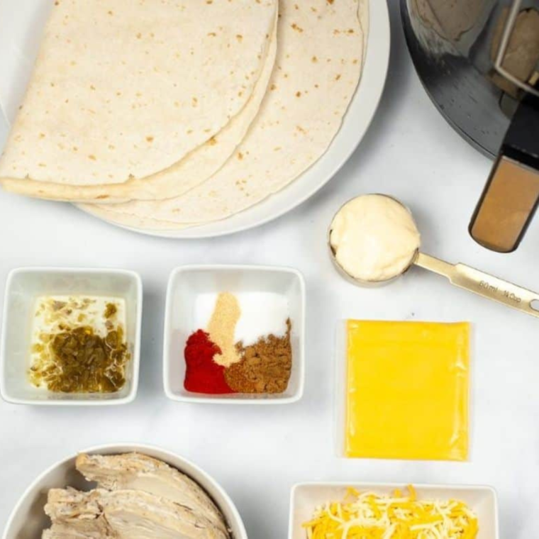 Ingredients needed for Air Fryer Copycat Taco Bell Quesadilla on kitchen table.