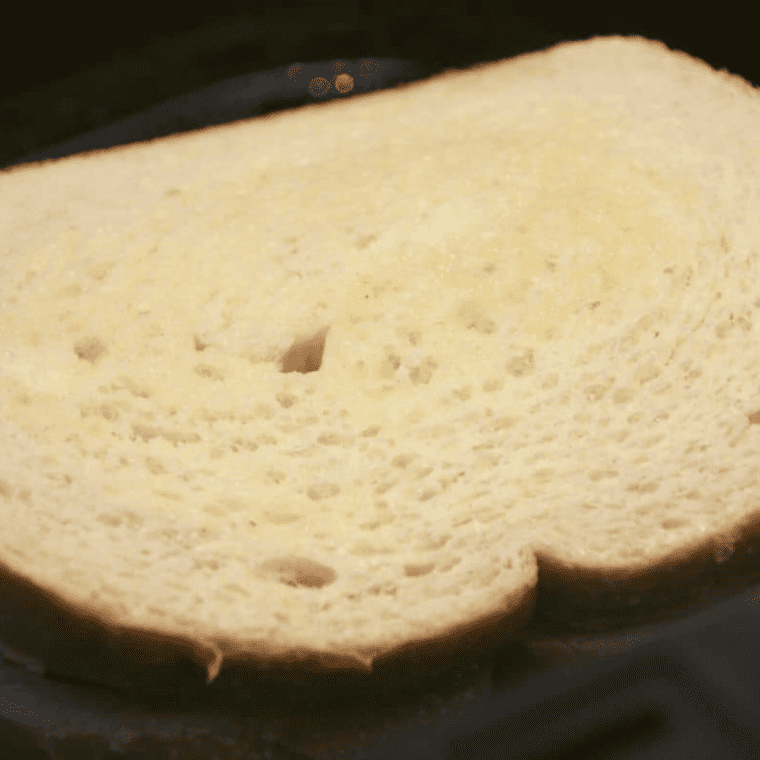 Air Fryer Tomato Grilled Cheese in the air fryer basket.