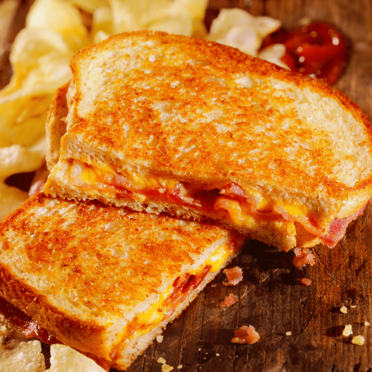 Air Fryer Grilled Cheese with feta, tomato, and basil, crispy and golden brown."