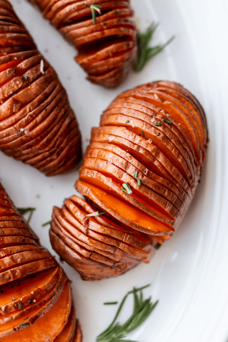  Close-up of perfectly cooked Air Fryer Hasselback Sweet Potatoes with crispy edges.