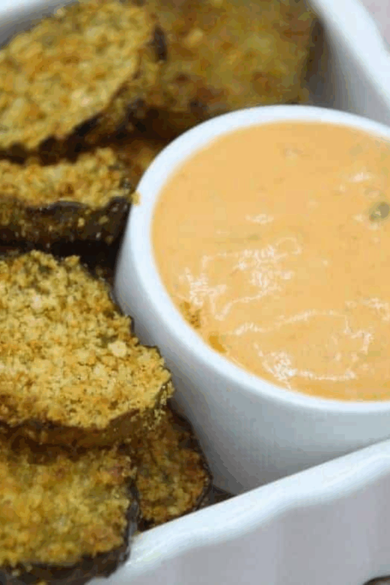 Golden, crispy Air Fryer Shake and Bake Fried Pickles served with dipping sauce.