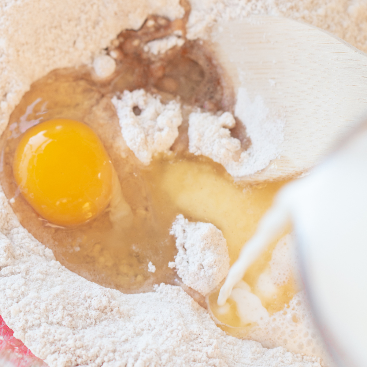 Whisking flour, sugar, cinnamon and baking soda in a mixing bowl