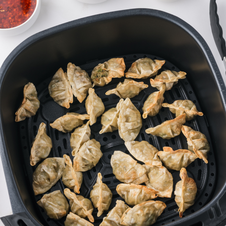 Close-up of basket air fryer with removable tray