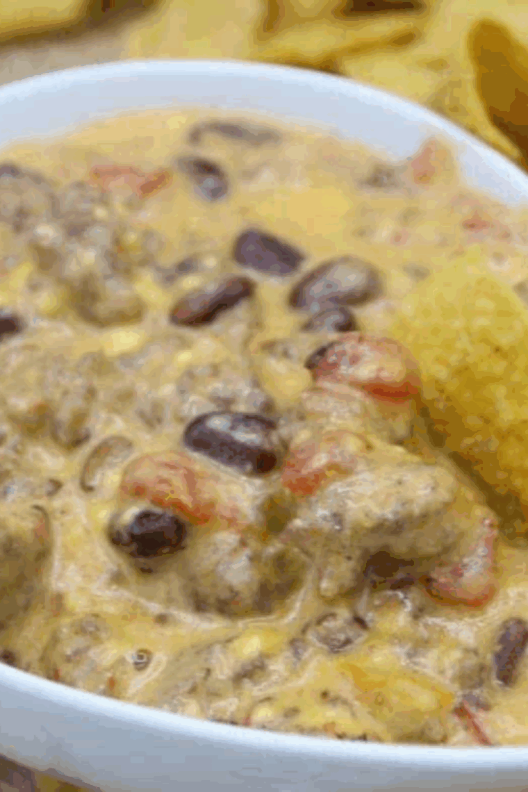 Creamy, cheesy Ninja Foodi spicy sausage queso dip served with tortilla chips