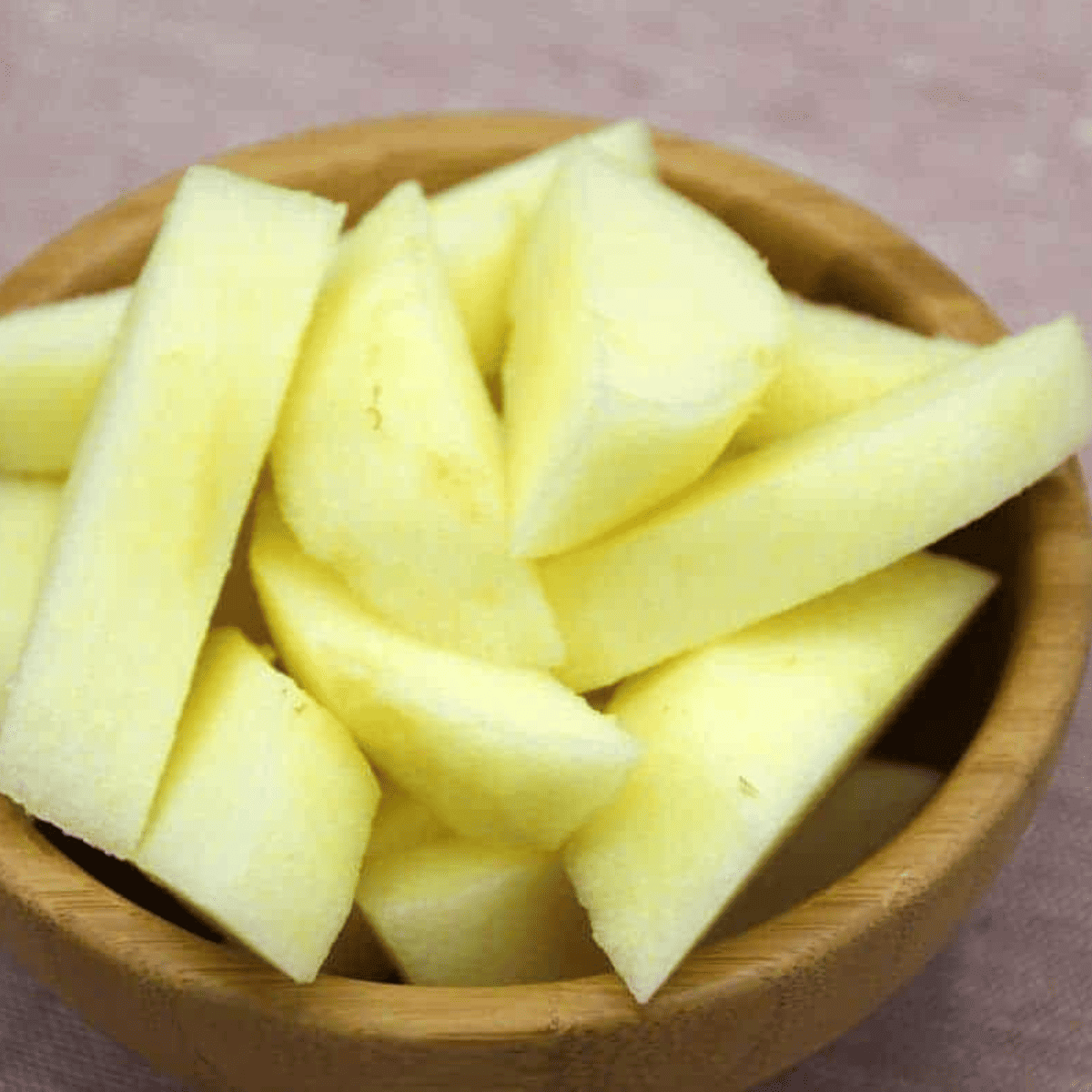 Add diced apples to a bowl.