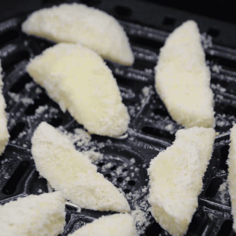 Place the apple slices in the air fryer basket, ensuring they are evenly spread out.
