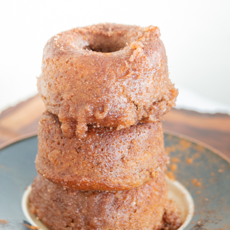 Cinnamon and sugar mixed in a shallow bowl for coating air fryer churro donuts