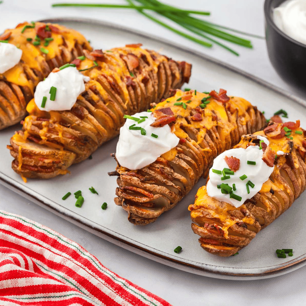 Air Fryer Hasselback Potatoes with golden-brown crispy edges served on a plate.