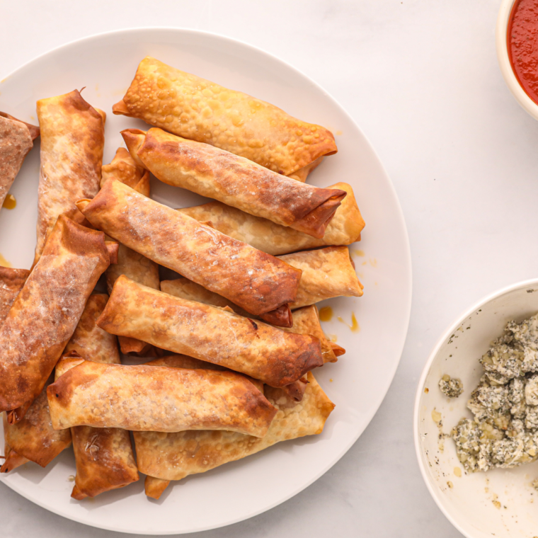 Cheese pull from a freshly cut homemade air fryer pizza egg roll