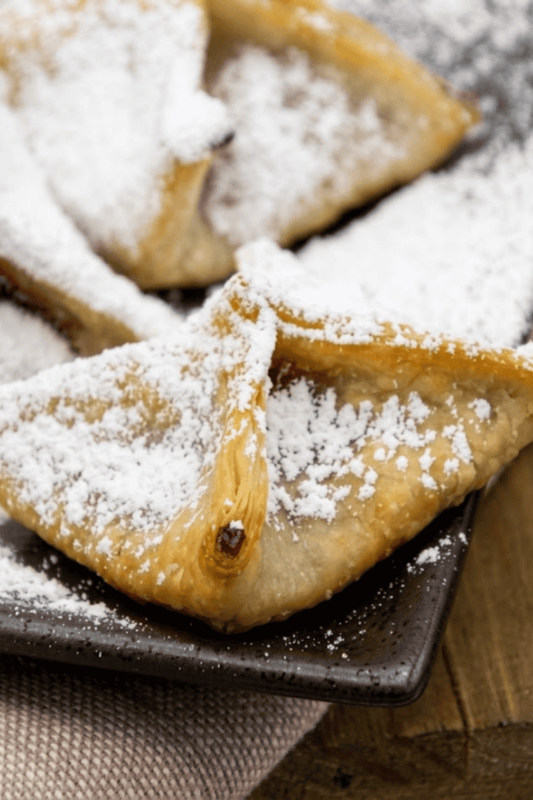 Golden raspberry wontons from the air fryer with a crisp shell and melted raspberry filling inside.