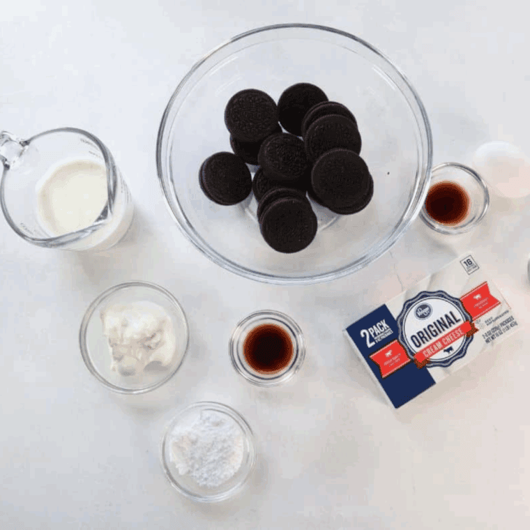 Ingredients needed for Copycat Cheesecake Factory Oreo Cheesecake on kitchen table.