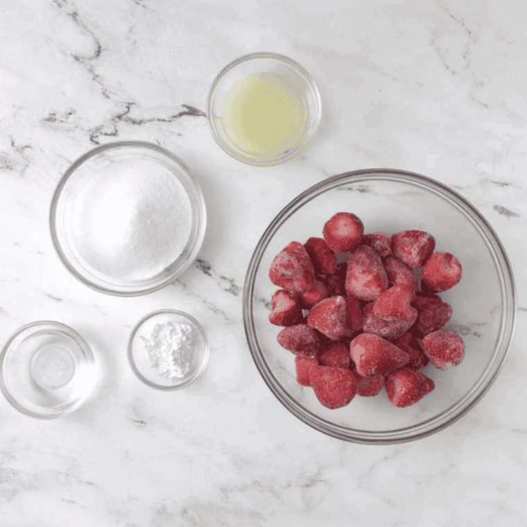 Ingredients needed for Cracker Barrel Copycat Strawberry Jam Recipe on kitchen table.