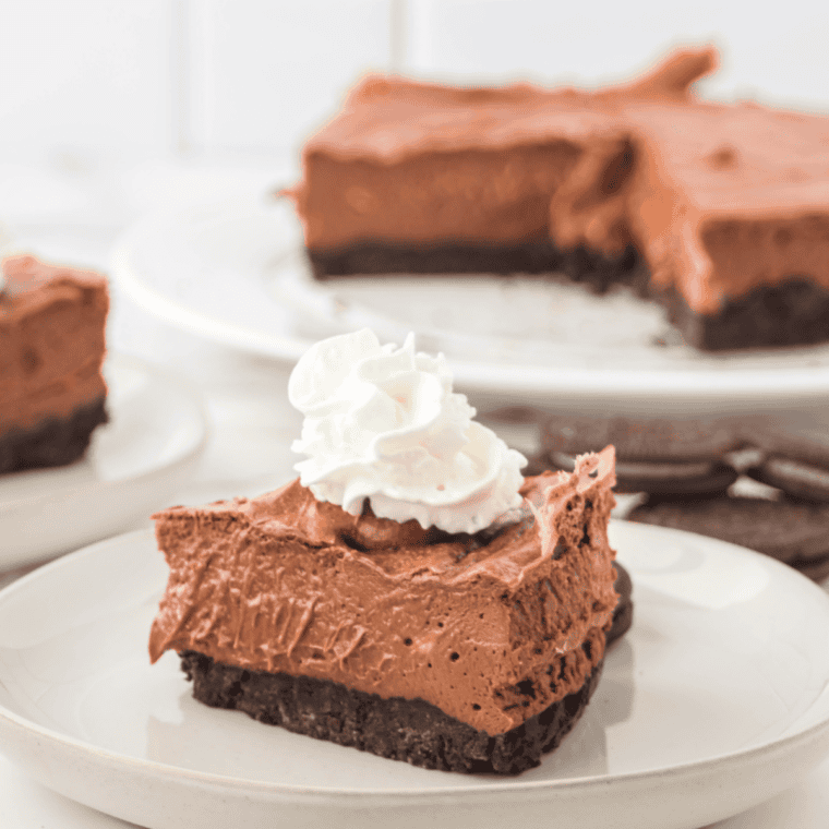 Slice of creamy chocolate cheesecake made in an air fryer, served on a plate.