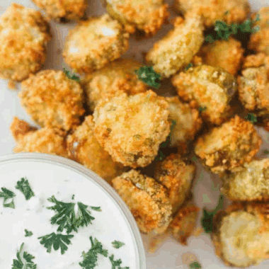Crispy, tangy, and perfectly seasoned, this Logan’s Roadhouse Fried Pickle copycat recipe is a crowd-pleasing appetizer you can make at home. Serve with ranch for the ultimate snack!
