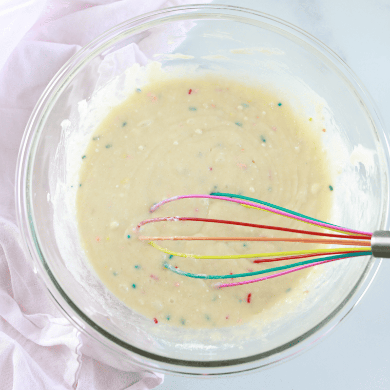Step-by-step Funfetti donut batter in a mixing bowl