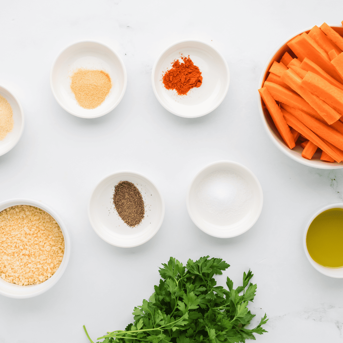 Ingredients for Air Fryer Carrot Fries on kitchen table.