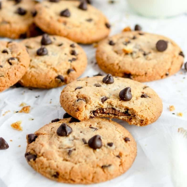 Freshly baked Air Fryer Copycat DoubleTree Cookies on a cooling rack, loaded with chocolate chips and crunchy walnuts.