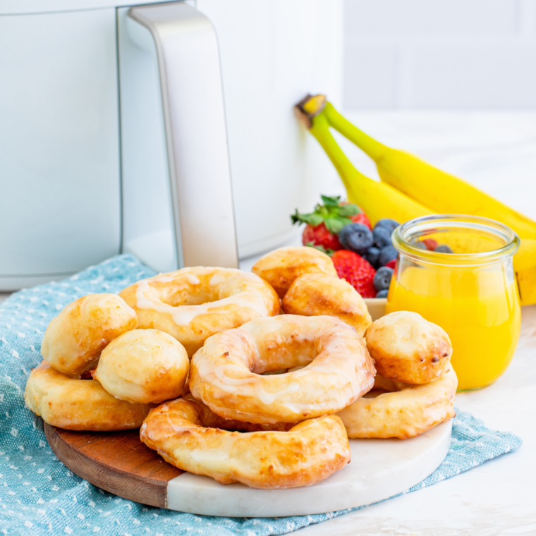 Freshly made air fryer copycat Krispy Kreme donuts with shiny sugar glaze