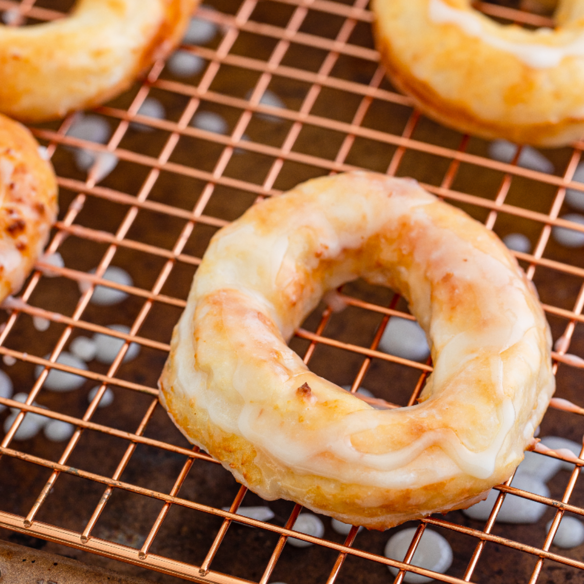 Place the glazed donuts on a wire rack and allow them to cool slightly before serving.