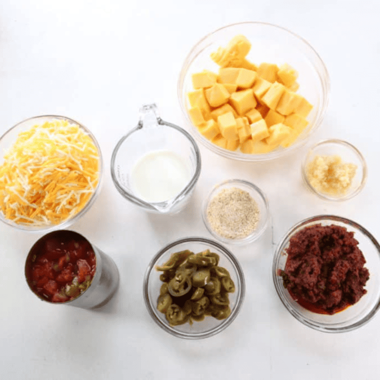Ingredients needed for queso on a kitchen table.
