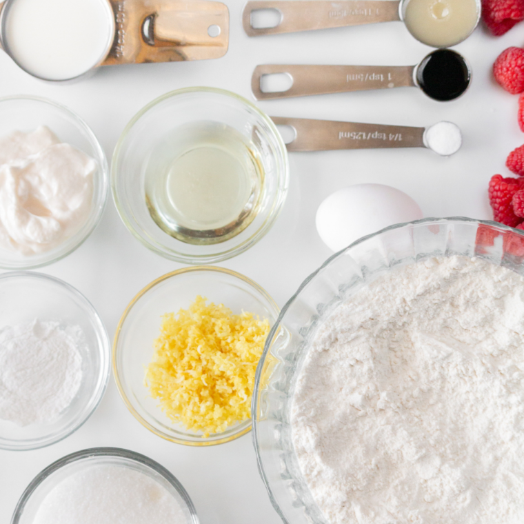 Ingredients needed for Air Fryer Raspberry Lemon Donuts on kitchen table.