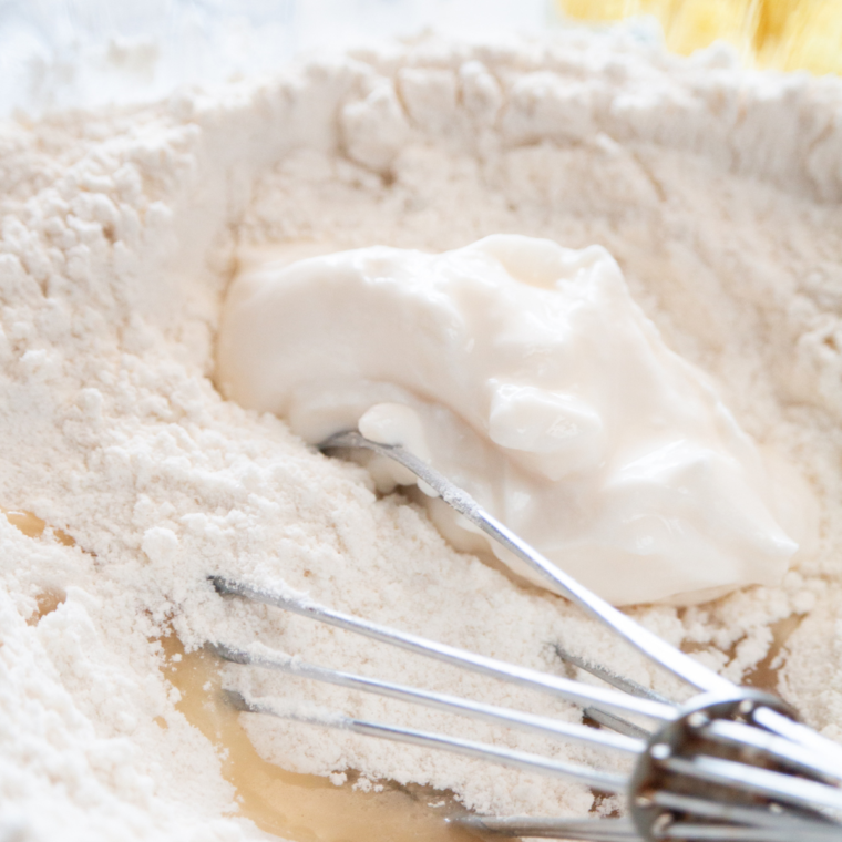 Mixing all-purpose flour, baking soda, baking powder, and salt in a large bowl