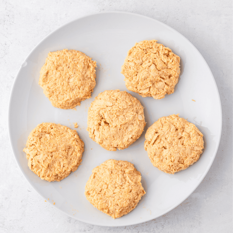 Shaping salmon patty mixture into 4-6 uniform patties, about 1 inch thick, for even cooking.
