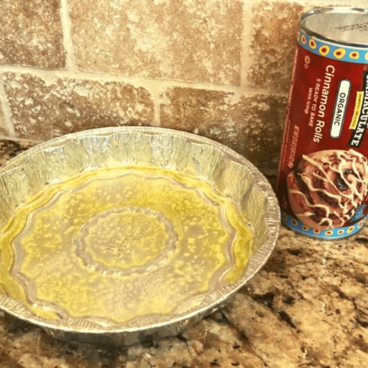 Can of refrigerated cinnamon rolls and icing packet for Blackstone griddle cinnamon rolls