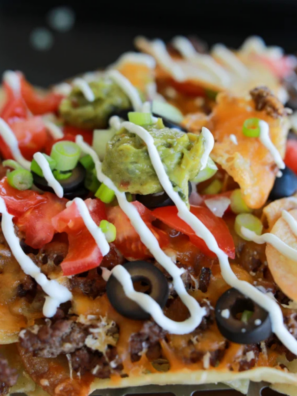 Loaded Blackstone Nachos made entirely on the griddle — crispy chips, seasoned beef, melty cheese, and all your favorite toppings. Ready in 20 minutes.