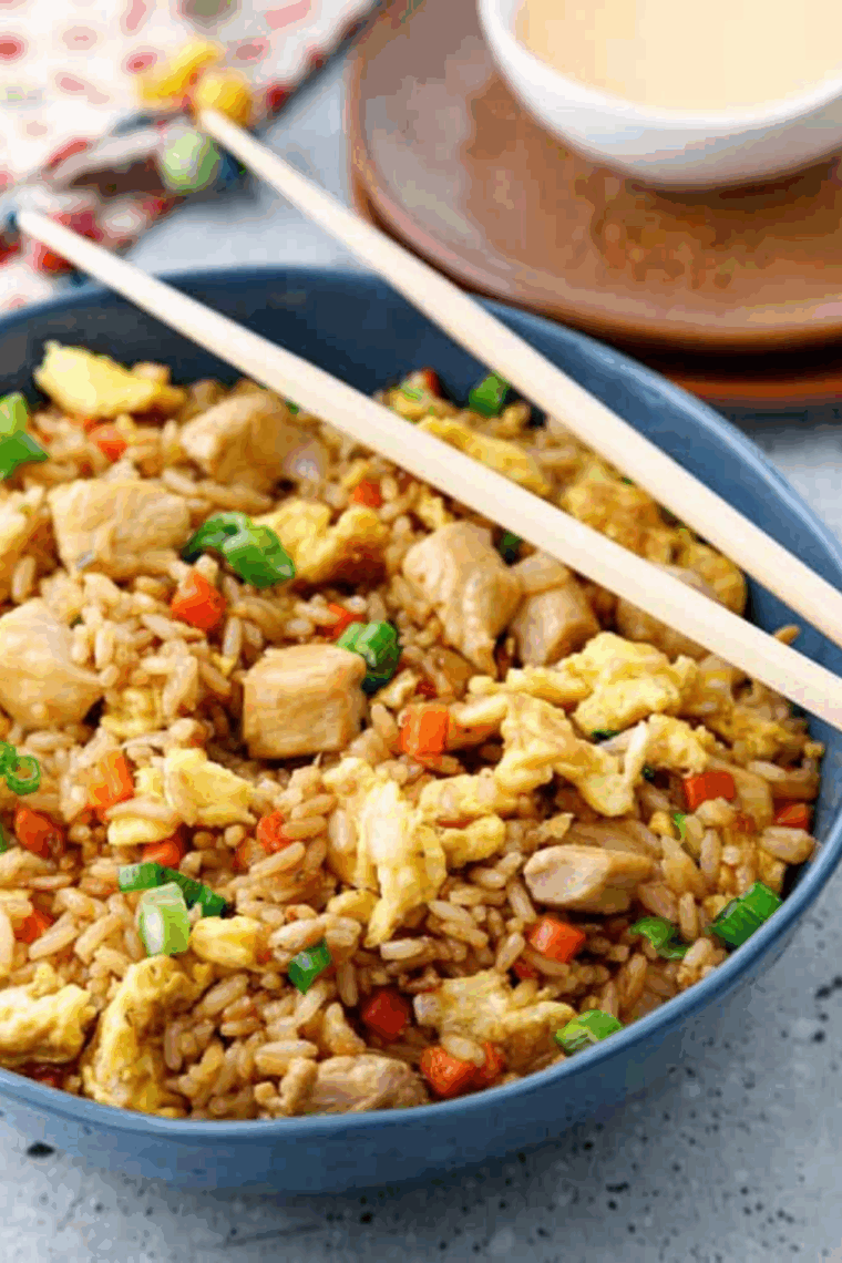 Air fryer basket filled with golden, crispy frozen fried rice