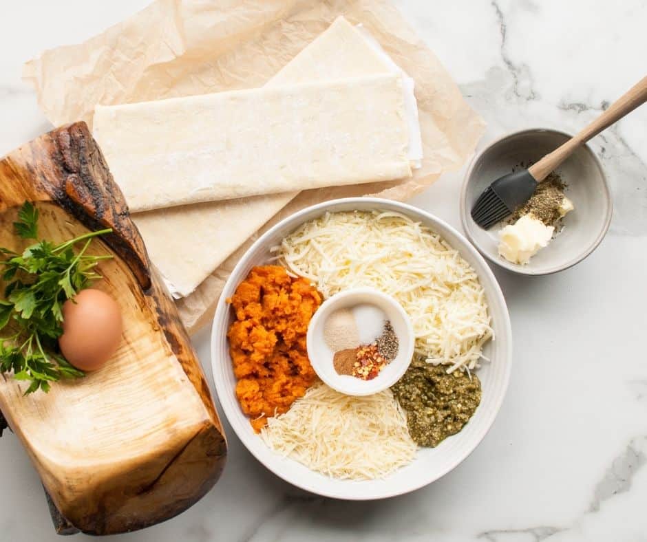 Ingredients Needed For Air Fryer Savory Pumpkin Twists With Puff Pastry on table.